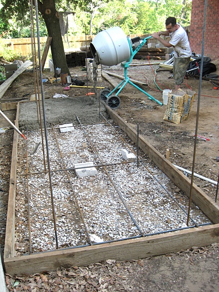 Pouring a slab foundation or footing for an outdoor fireplace and pizza oven