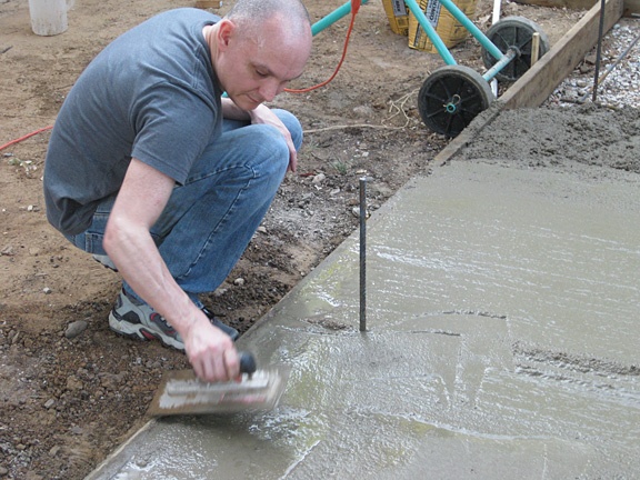 Troweling the concrete slab or footing