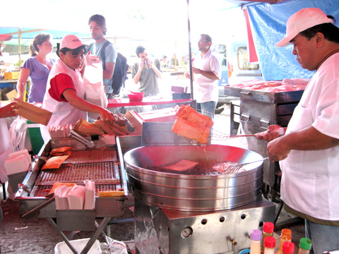 Brazilian street vendors making pasteles